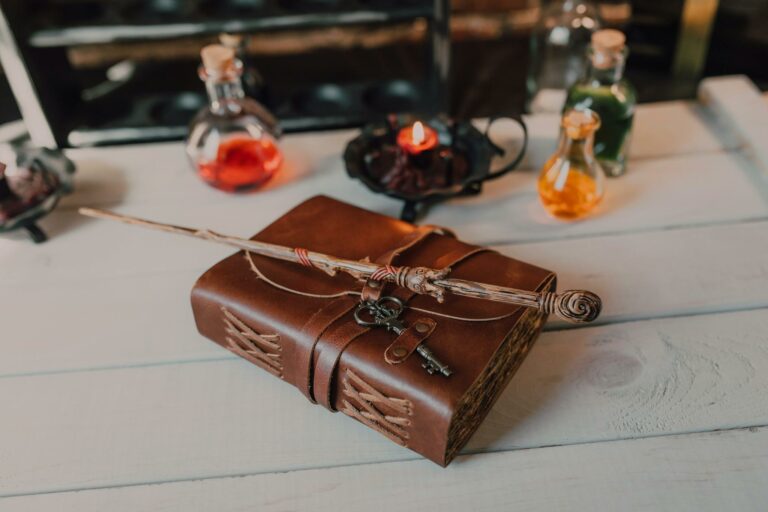 A vintage spellbook with a magic wand and potion bottles on a rustic table, evoking mystical vibes.